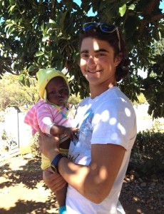 Mizrahi with a local Zimbabwean orphan.