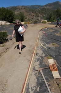 Mrs, Whipple enjoys the new, easy-to-walk-path to the girls' dorm.