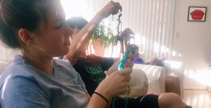 Sophomore Maya Mullins does her thing during knitting elective -- Photo by Clover Griffen