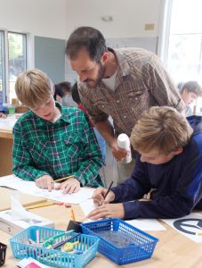 Woodshop teacher Ryan Lang added his expertise to the clock-making process -- Photo by Misty Volaski
