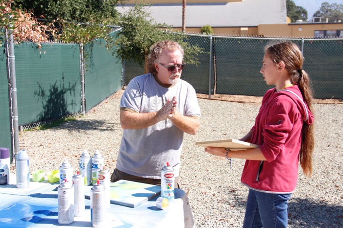 Mr. Burright provides guidance to eighth-grader Grace McHale during the clock-making process -- Photo by Misty Volaski